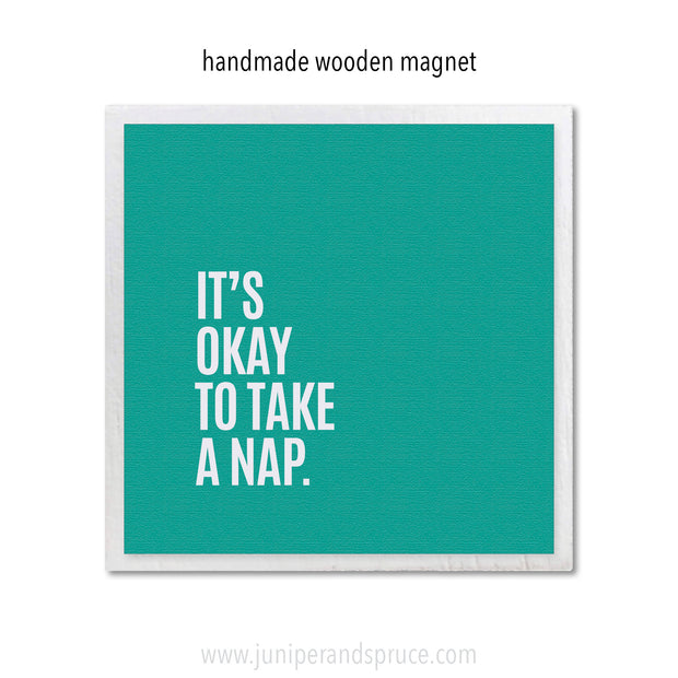 Teal square magnet with white text 'It's okay to take a nap' on a white background